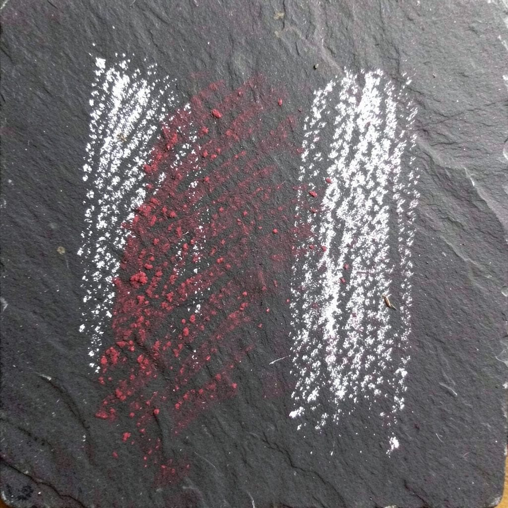 Chalk drawing on a dark slate board of a stylized photo-editing icon with soft blue and white chalk lines, a clean modern mood